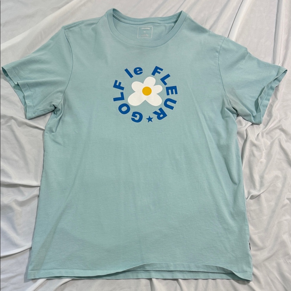 Golf Le Fleur Light Blue Tee with Daisy Logo